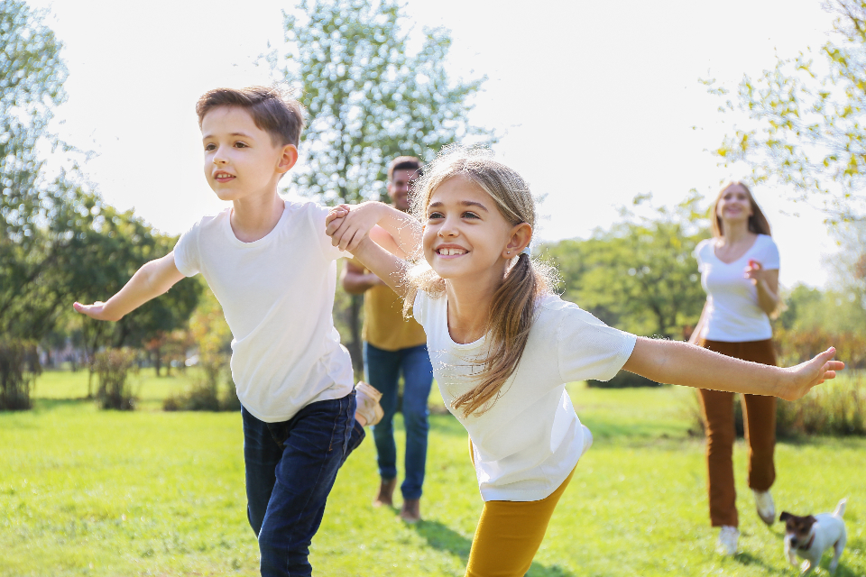 Kids playing outside on grass
